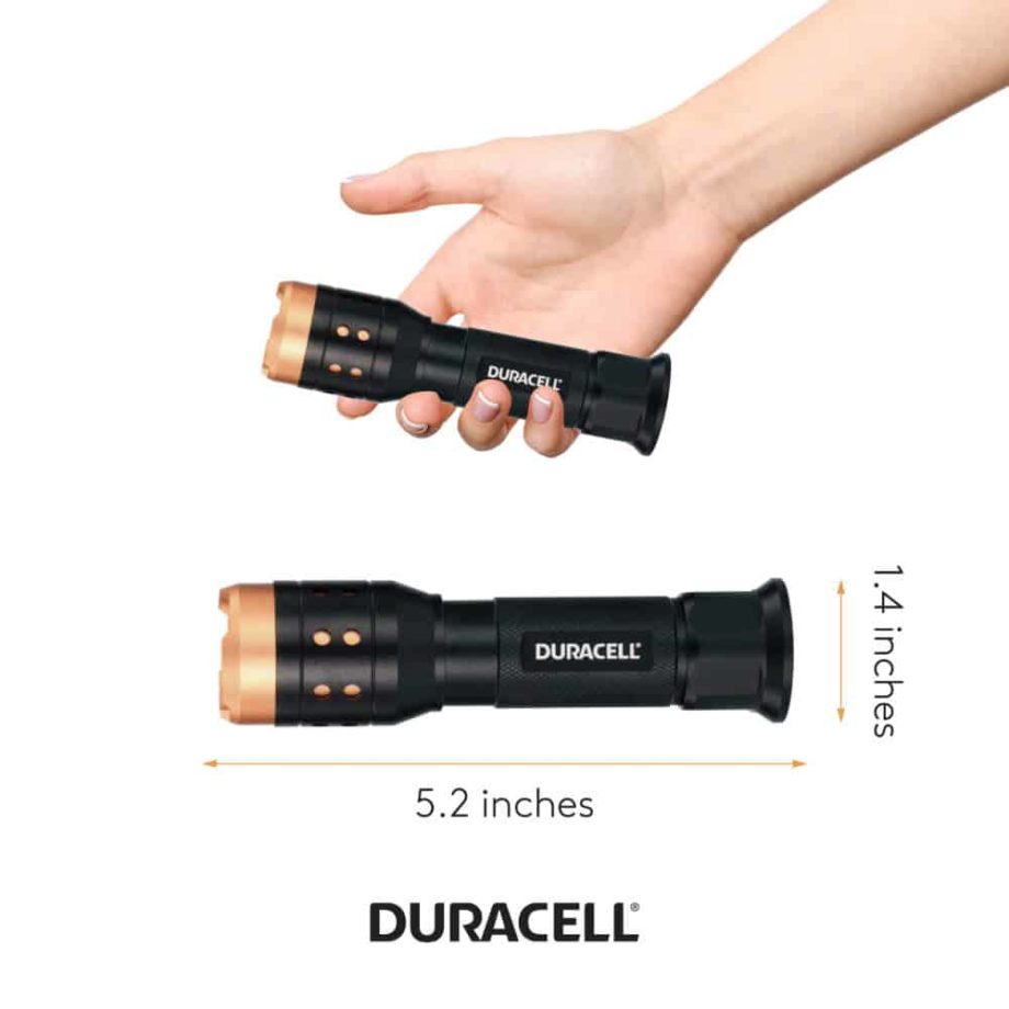 Person holding flashlight to show size